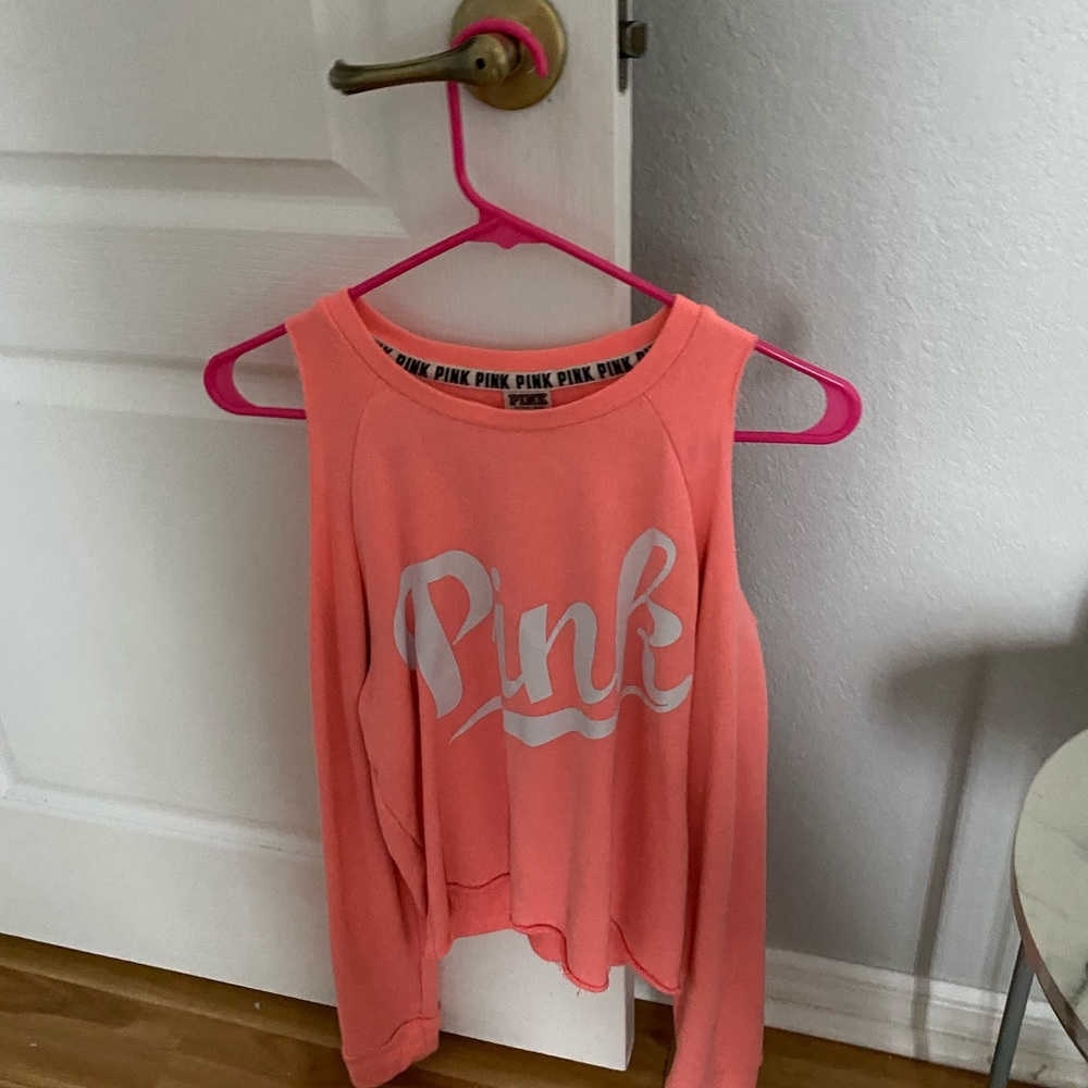 pink long sleeve with cuts on shoulders